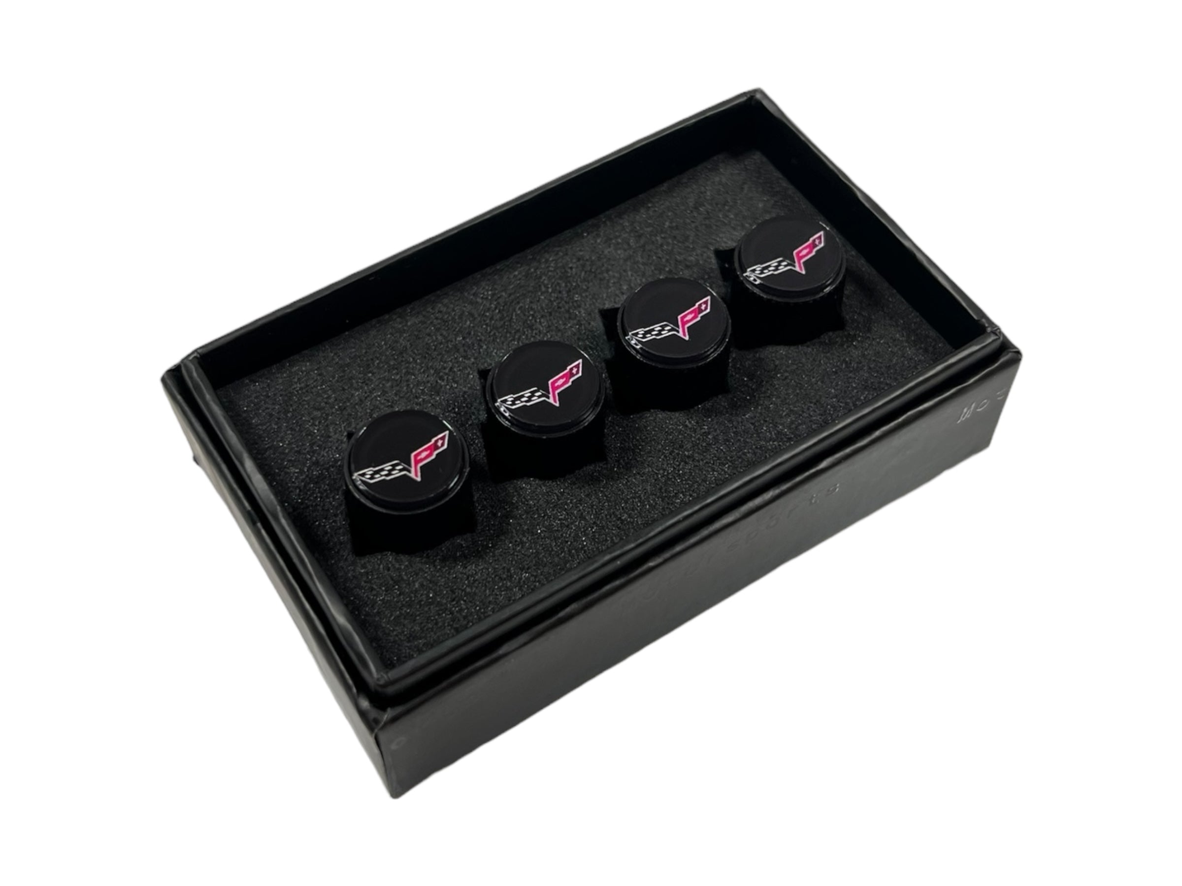 three black guitar picks in a black box