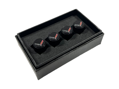 three black dices in a black box