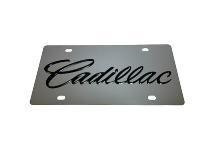 a metal license plate with the word cadillac on it