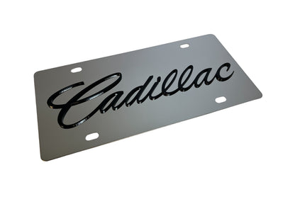 a metal license plate with the word cadillac on it