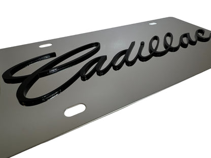 a metal sign with the word cadillac on it