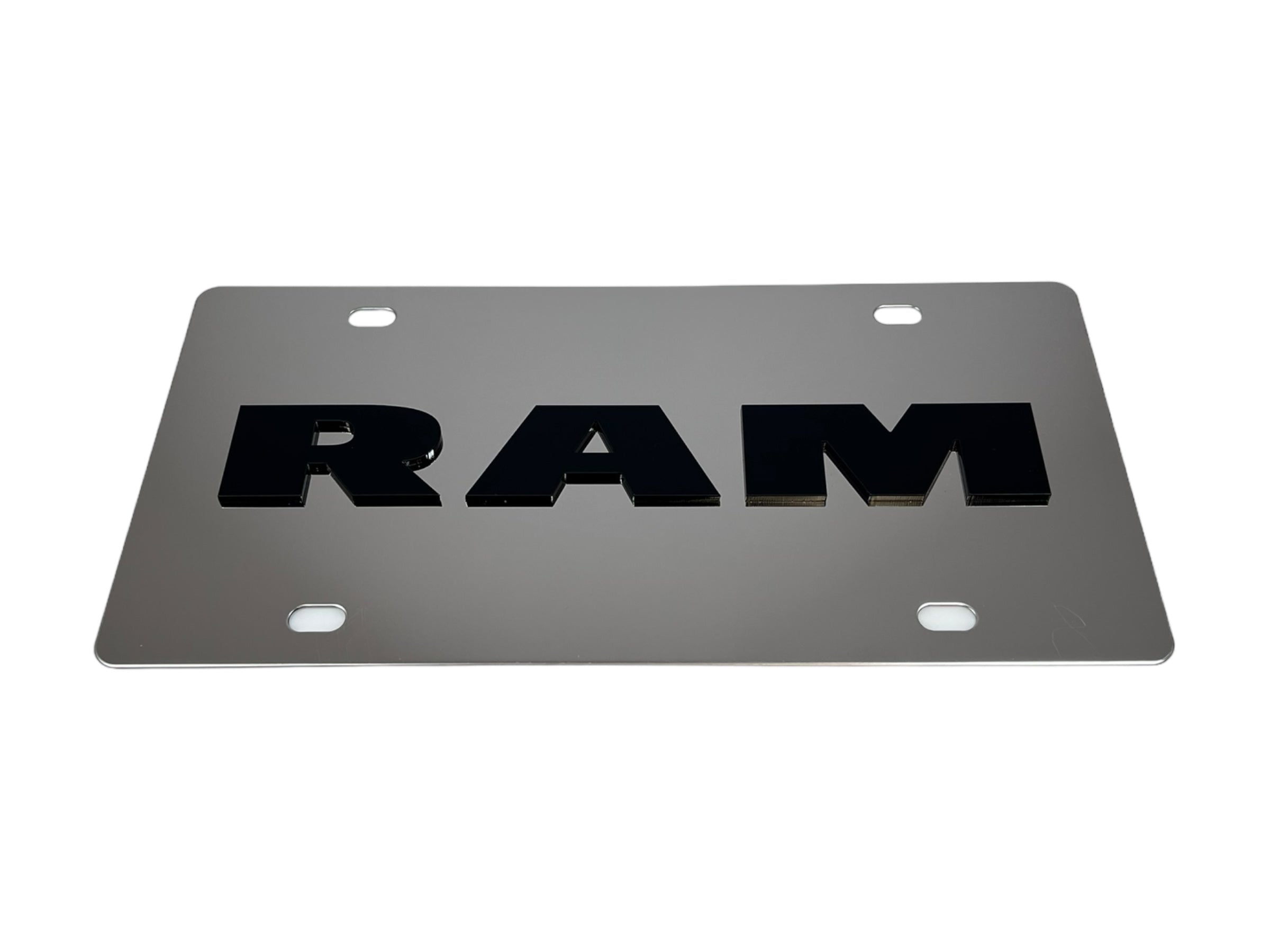 a metal license plate with the word ram on it