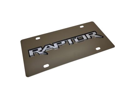 a metal license plate with the word raptor on it