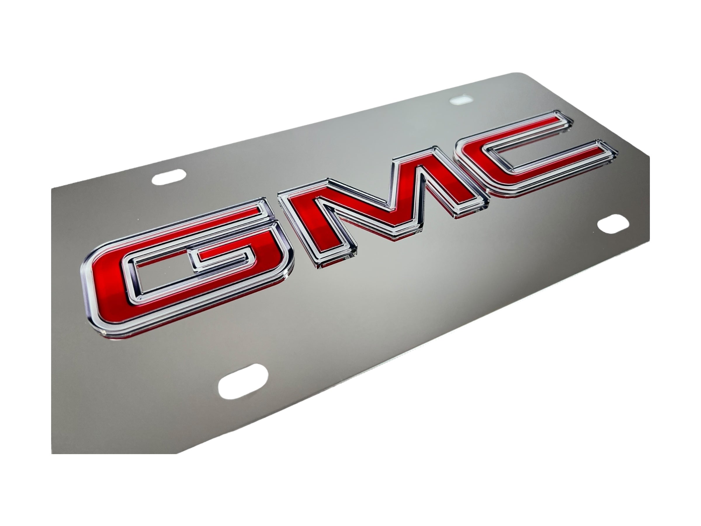 a chrome license plate with the gmc logo