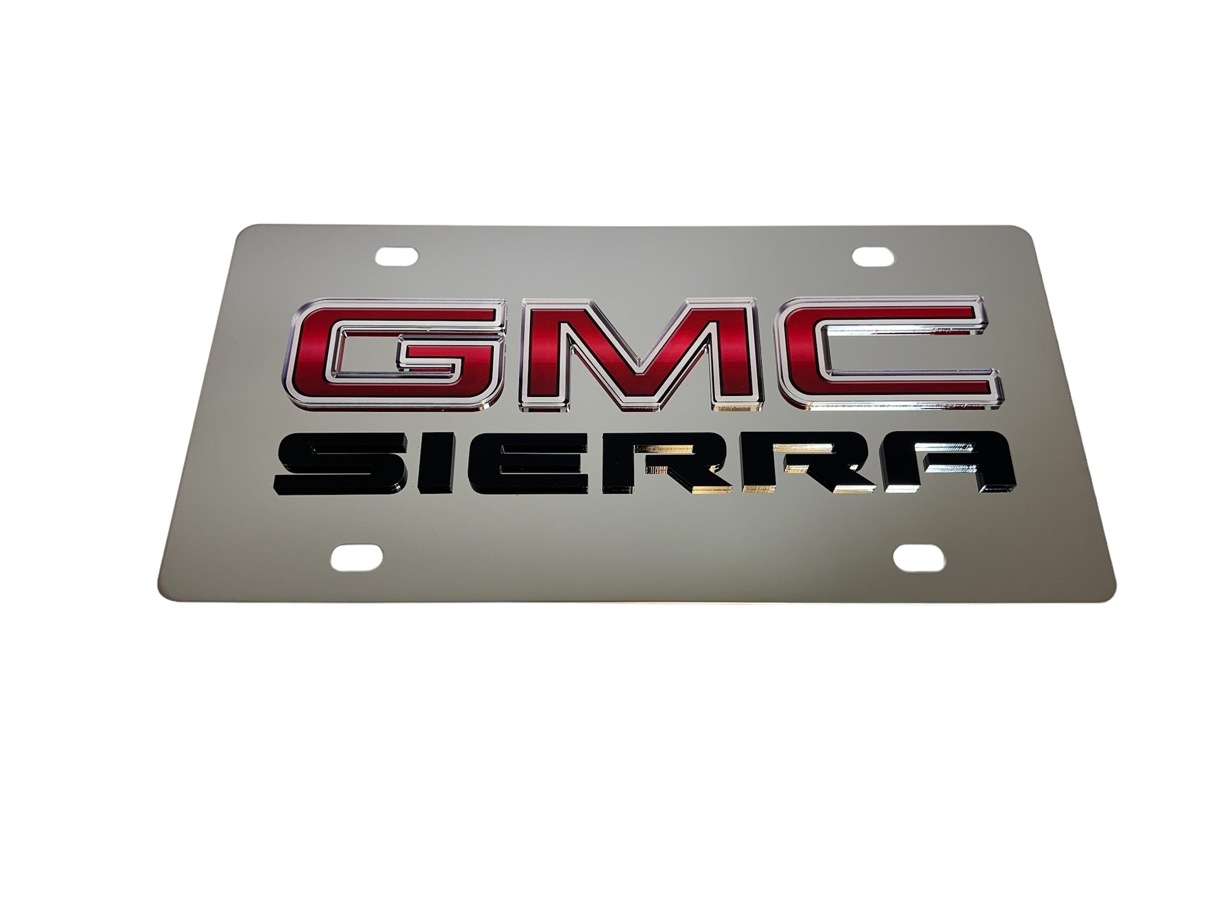 a silver license plate with the gmc sierra logo