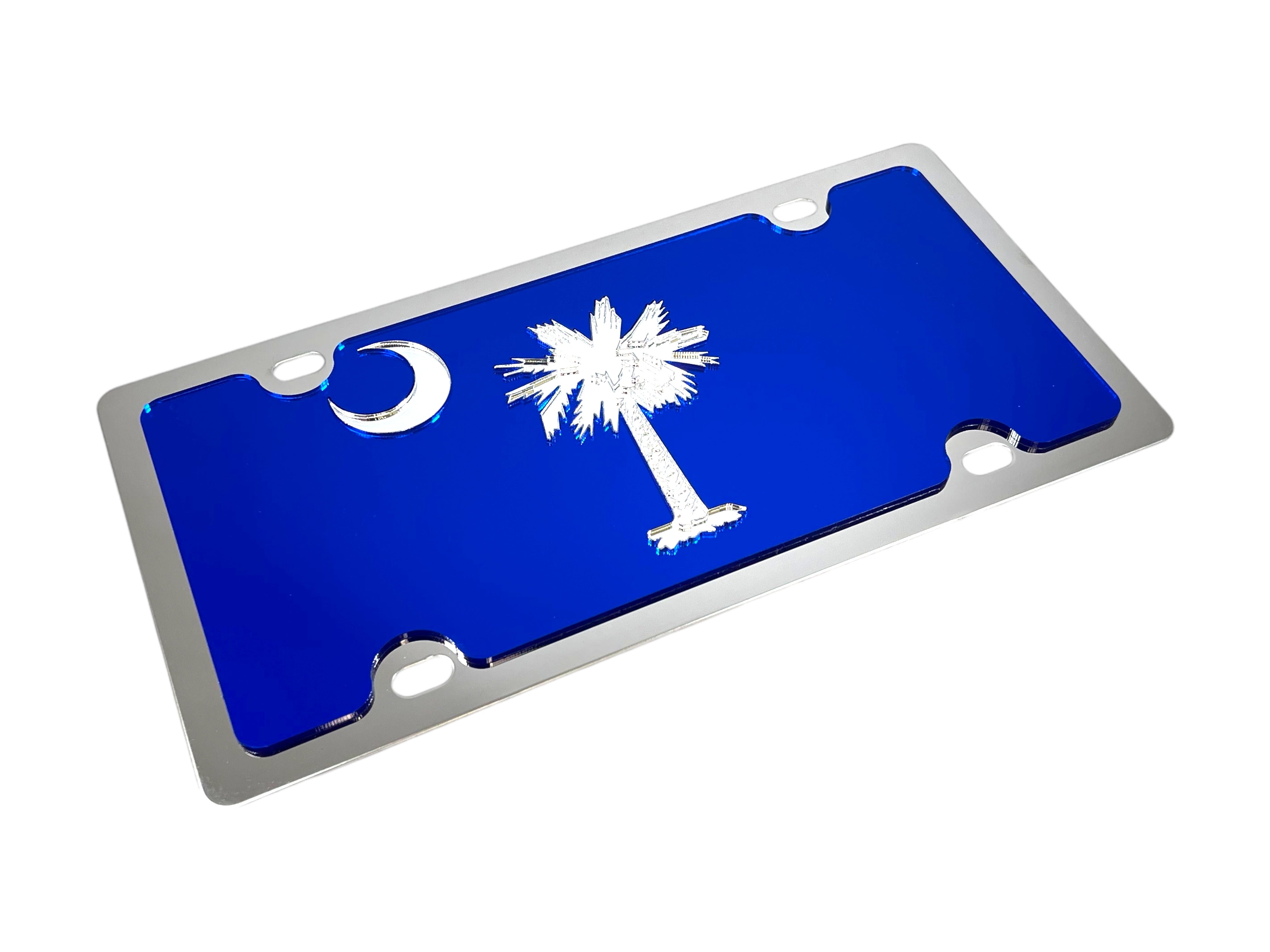 a metal license plate with a palm tree and a crescent