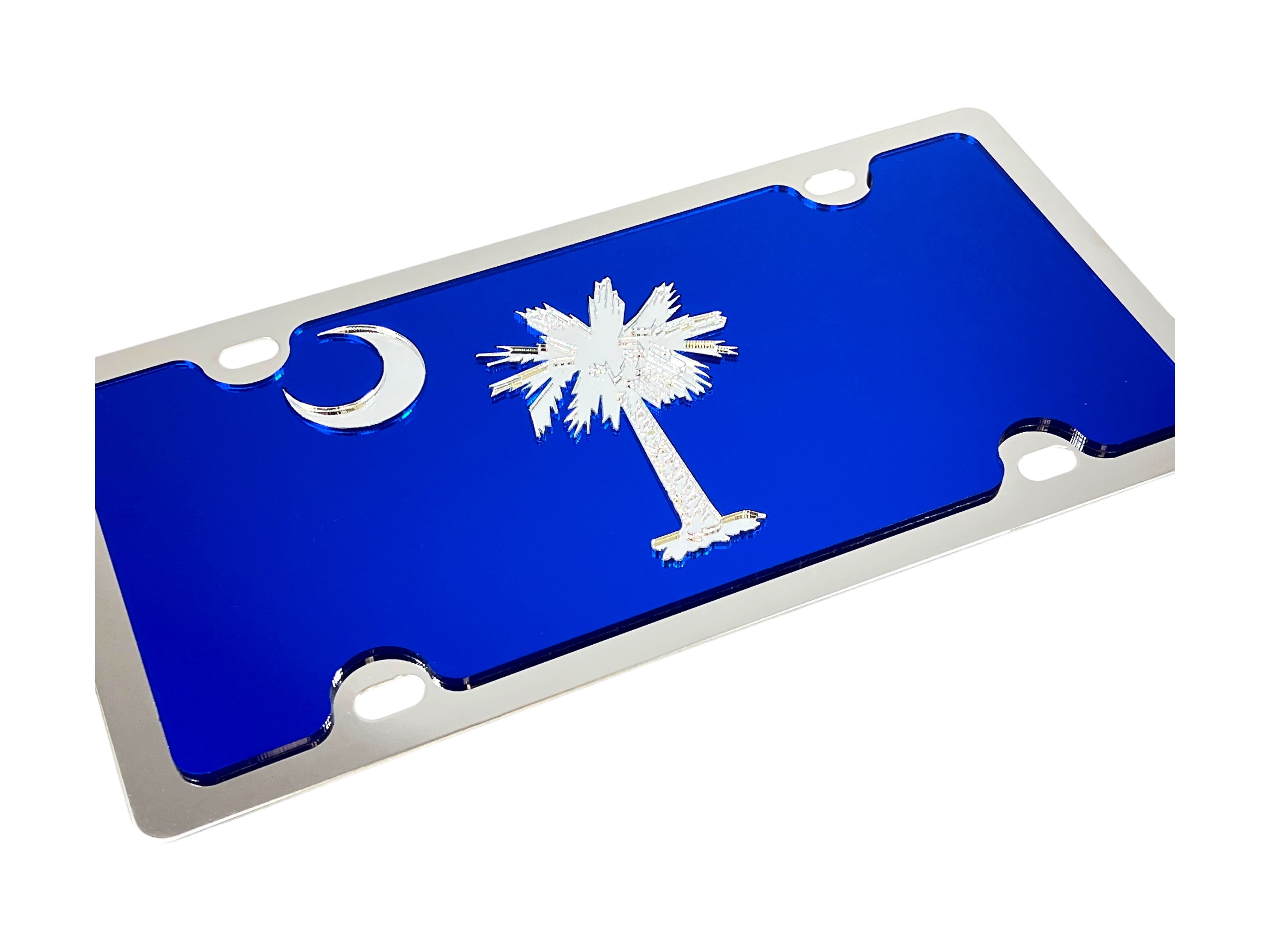 a blue license plate with a palm tree and the moon