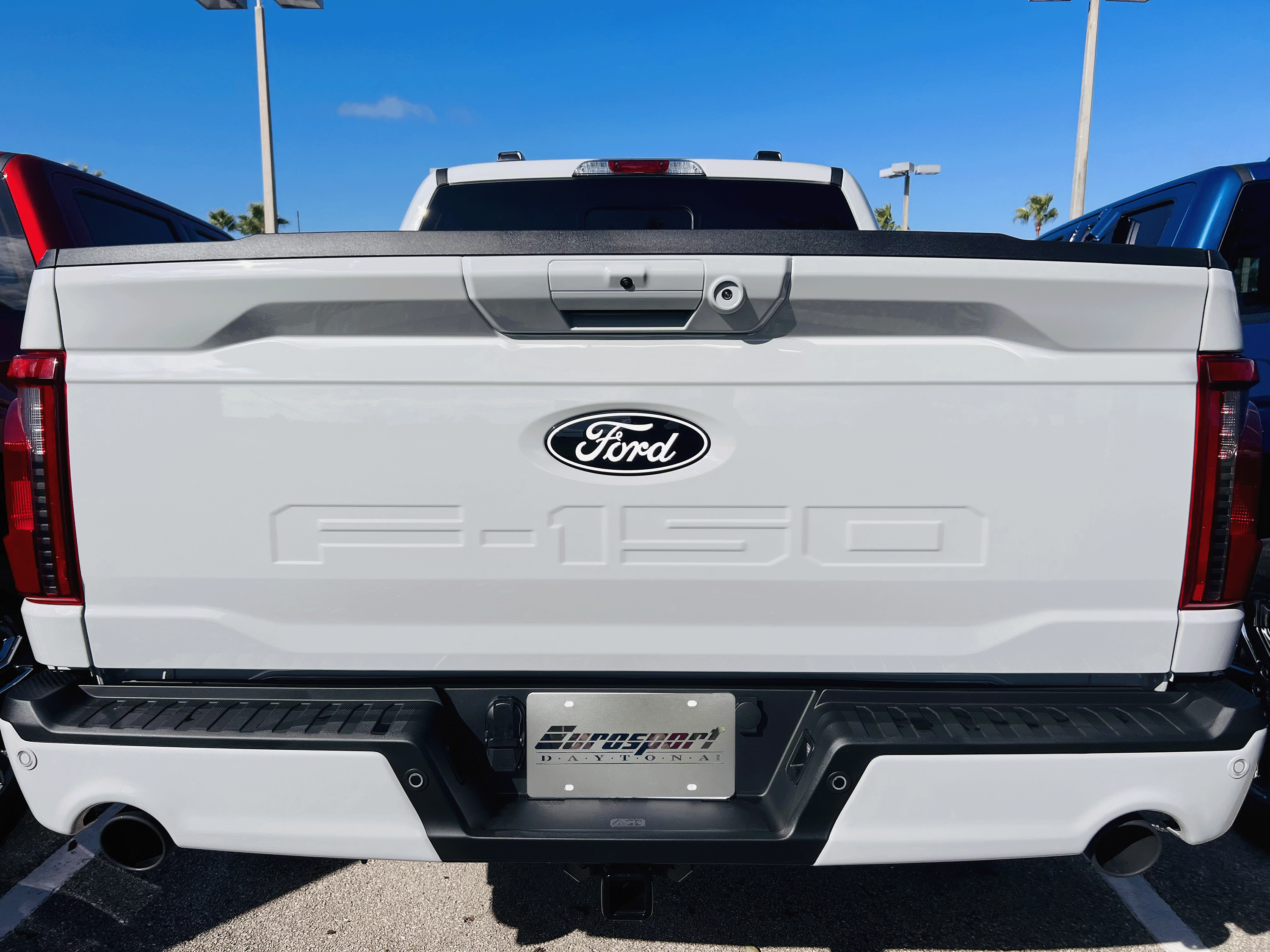 the back end of a white ford truck