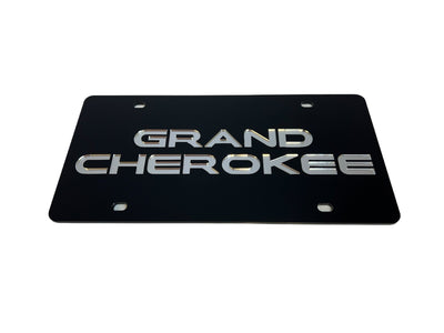 a black license plate with the words grand cherokee