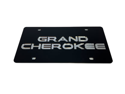 a black license plate with the words grand cherokee