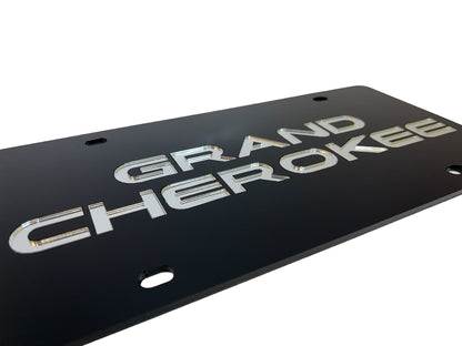 a black license plate with the words grand cheroker