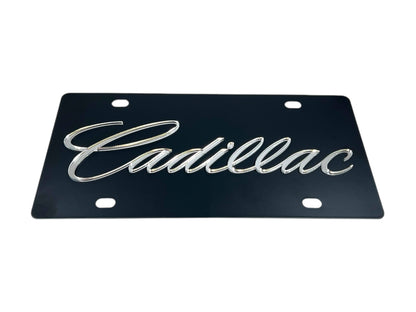 a black license plate with the word cadillac on it