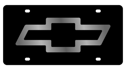 a silver chevrolet symbol on a black background