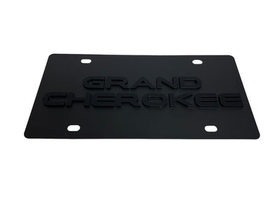a black license plate that says grand cherokee