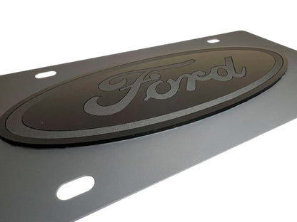 a metal sign with the word ford on it