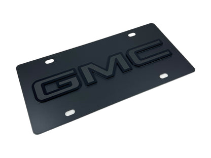 the gm logo on a black license plate