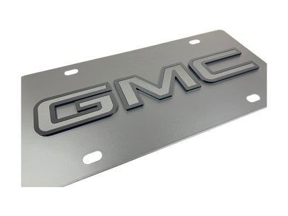 the gmc emblem is shown on a metal plate