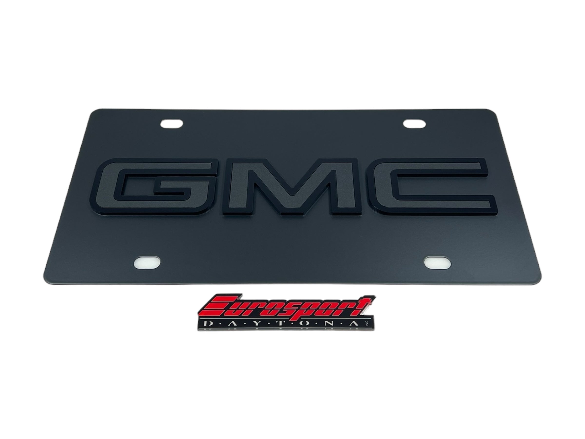 a black license plate with the gmc logo on it