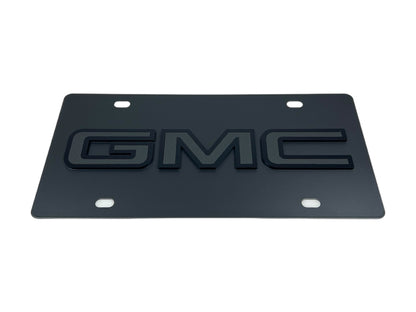 the gm logo on a black license plate