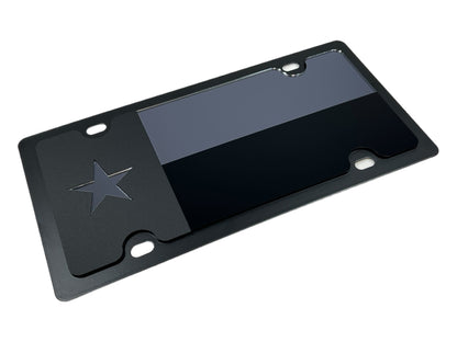 a black license plate with a star on it