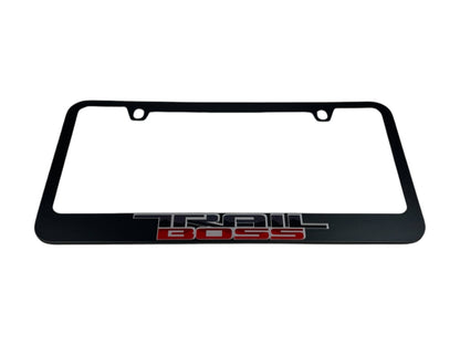 a black license plate frame with the word trail boss on it