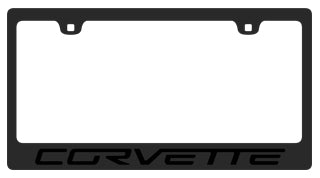 a black license plate frame with the word corvette on it