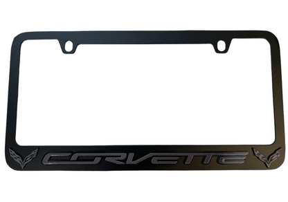 a black license plate frame with corvette logo