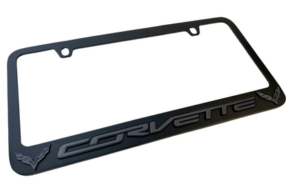 a black license plate frame with a corvette logo