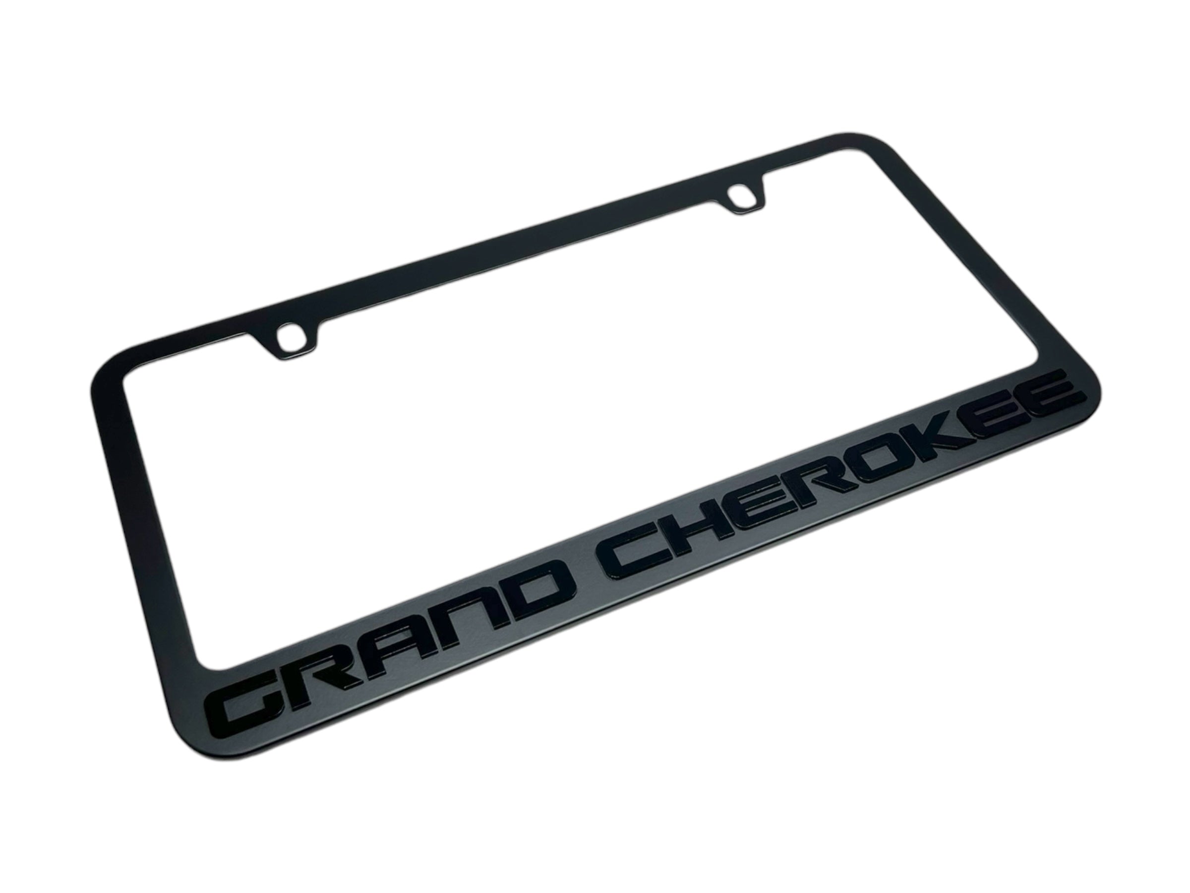 a black license plate frame with the word grand cheroke