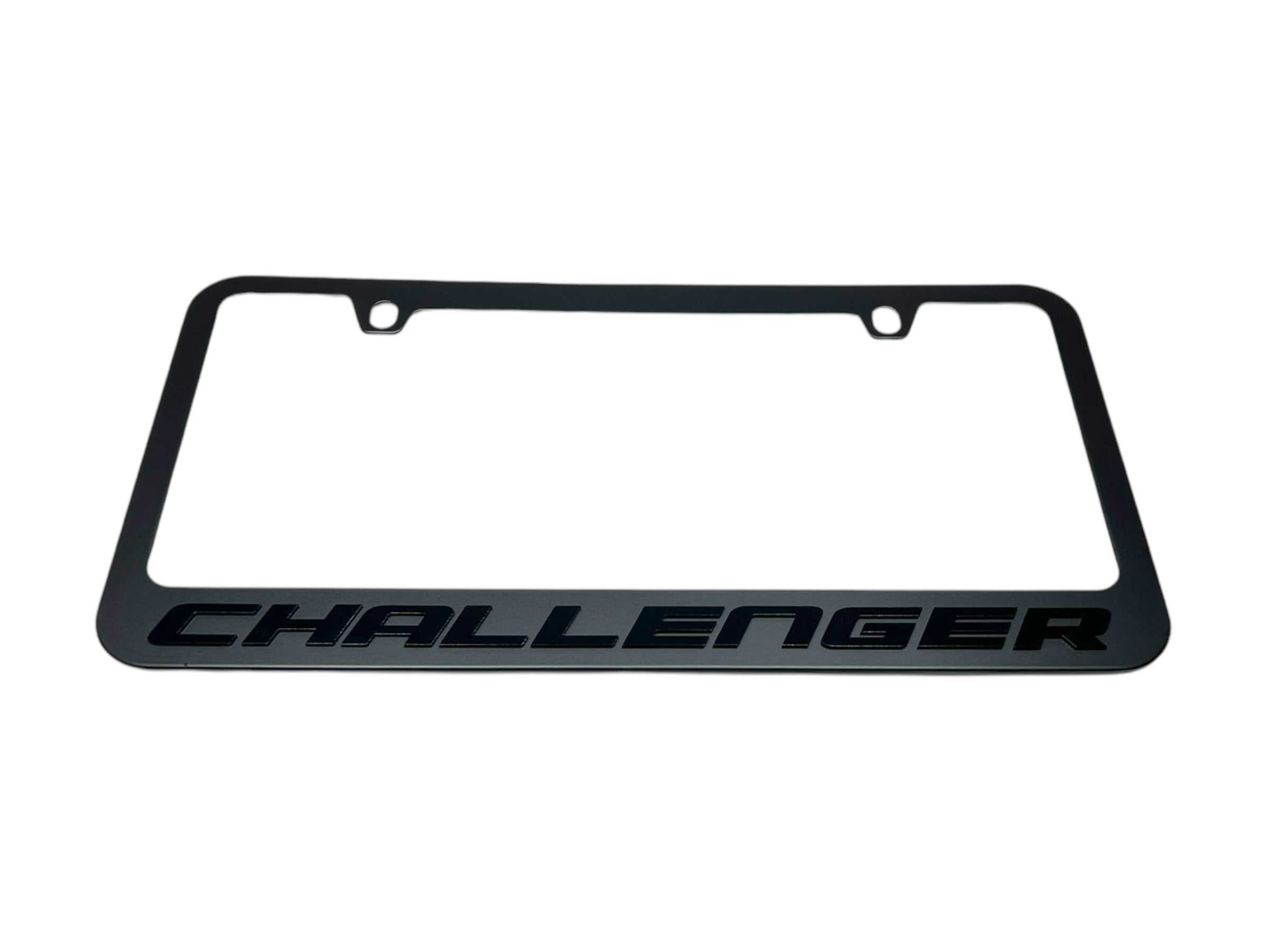 a black license plate with the word challenger on it