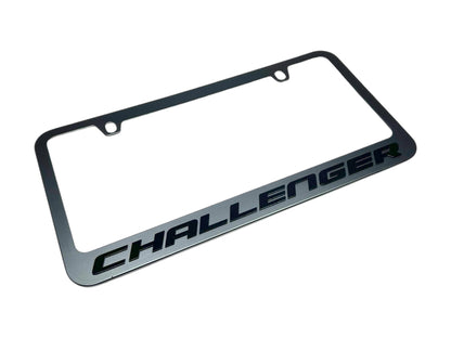 a chrome license plate with the word challenger on it