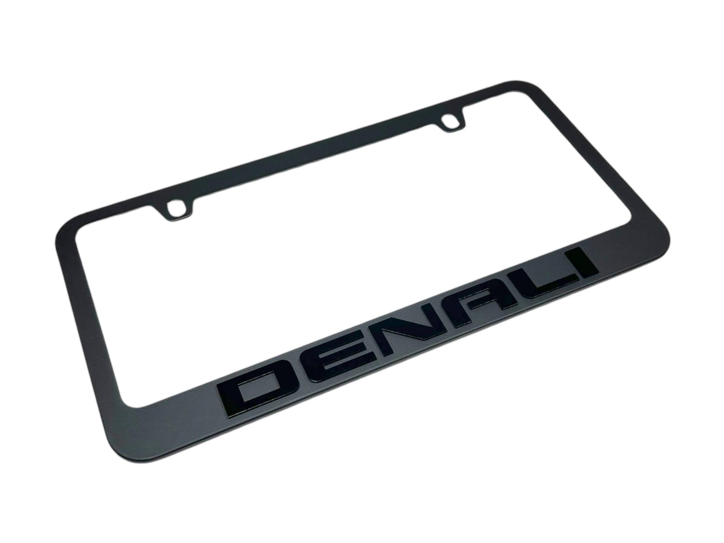 a black license plate frame with the word denali on it