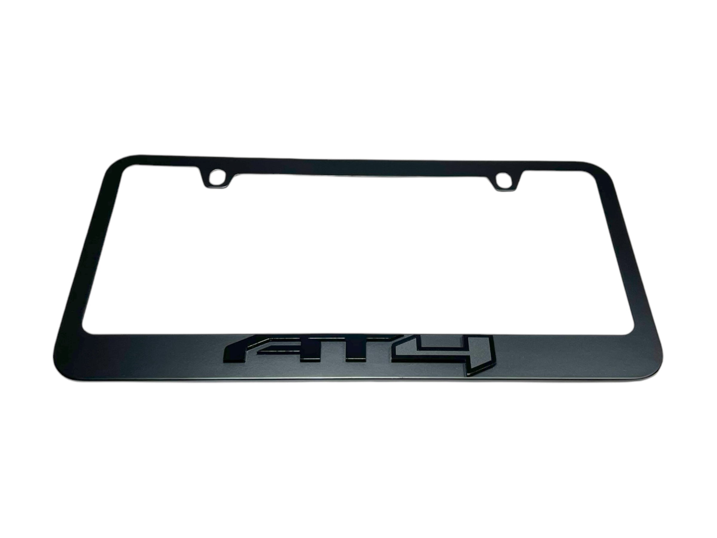 a black license plate frame with the letters gtp on it