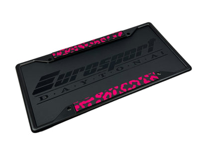 a black and pink license plate for a motorcycle