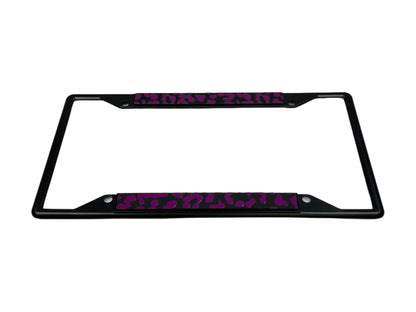 a black license plate frame with a pink leopard print