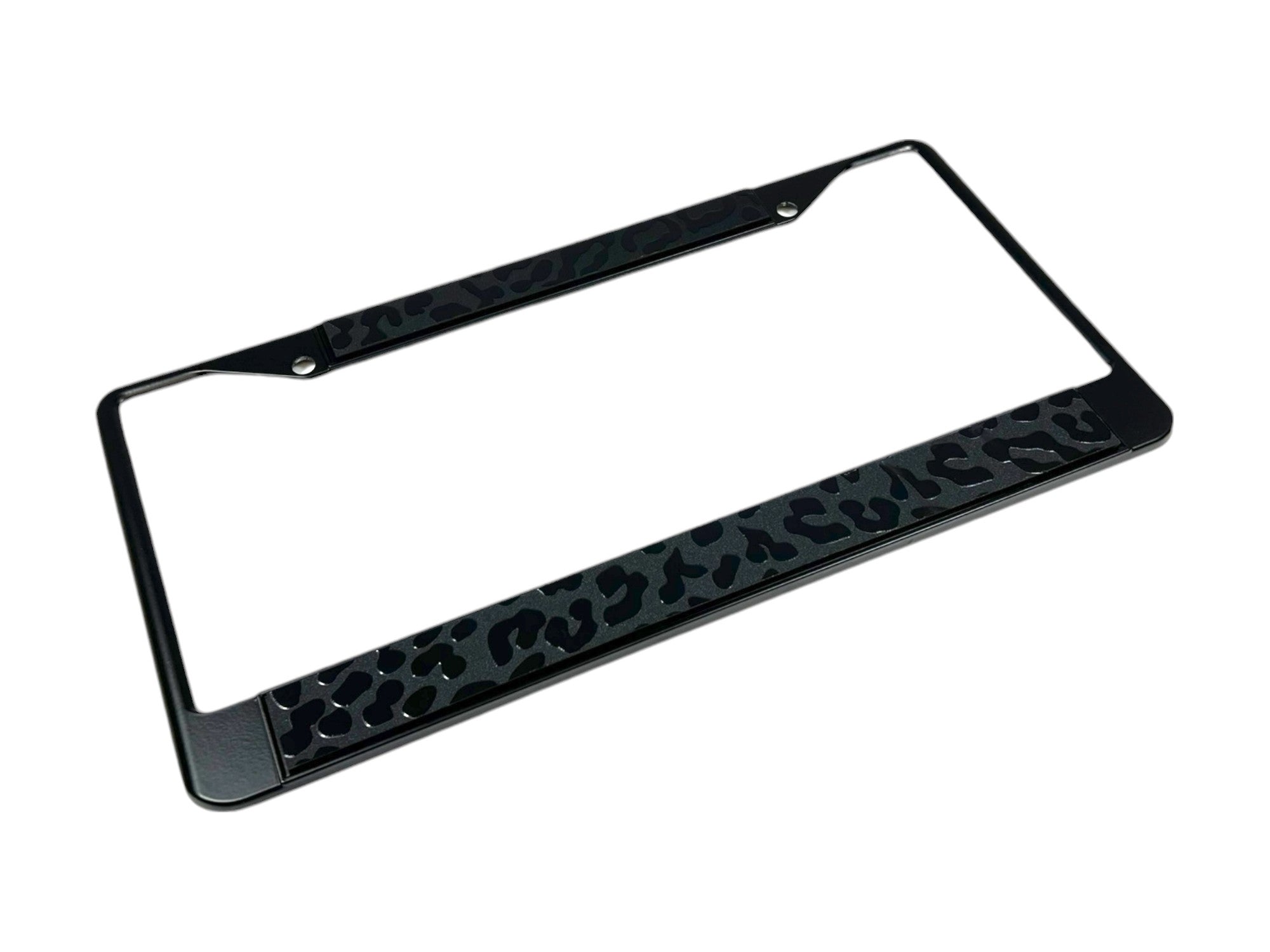 a black license plate frame with a leopard print