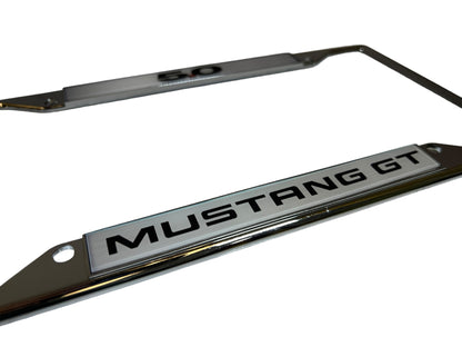 a metal license plate with the word mustang gt on it