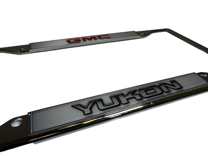 a pair of chrome license plates with the word vulcan on them