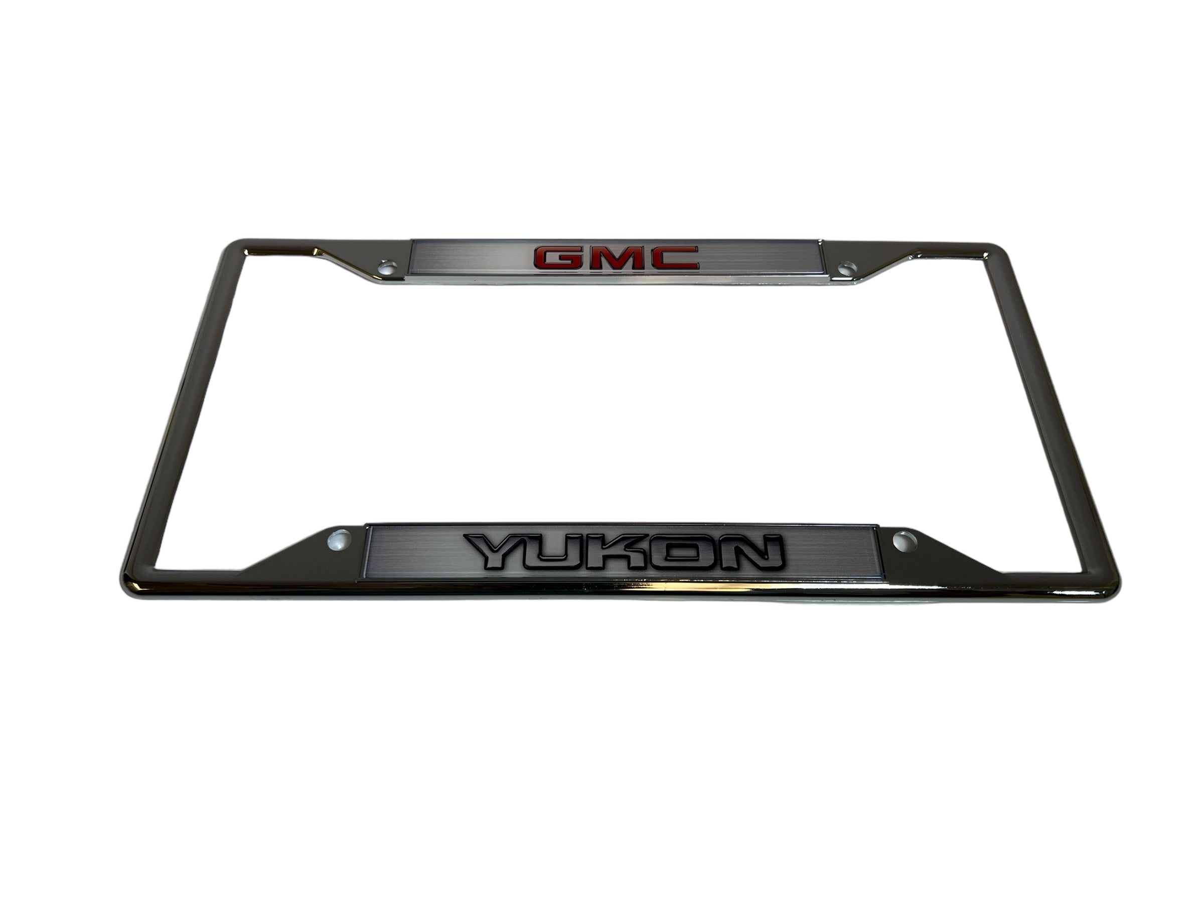 a chrome license plate frame with the gmc logo