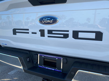 a close up of the front of a white ford f - 150