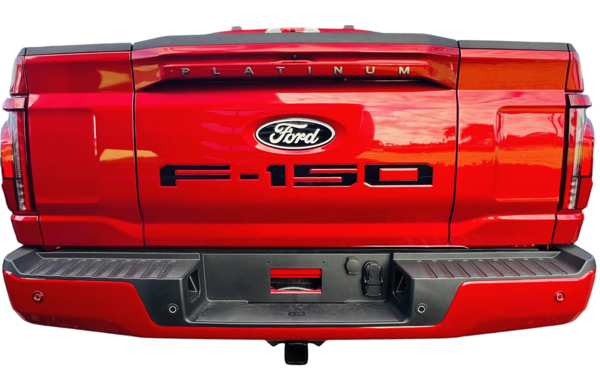 the rear end of a red ford f - 150 truck