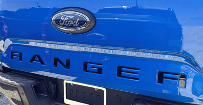 the rear end of a blue ford ranger truck