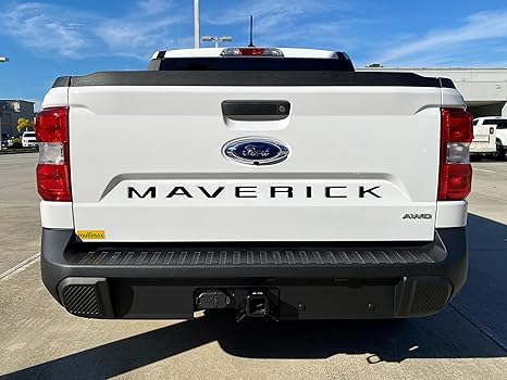 a white truck parked in a parking lot