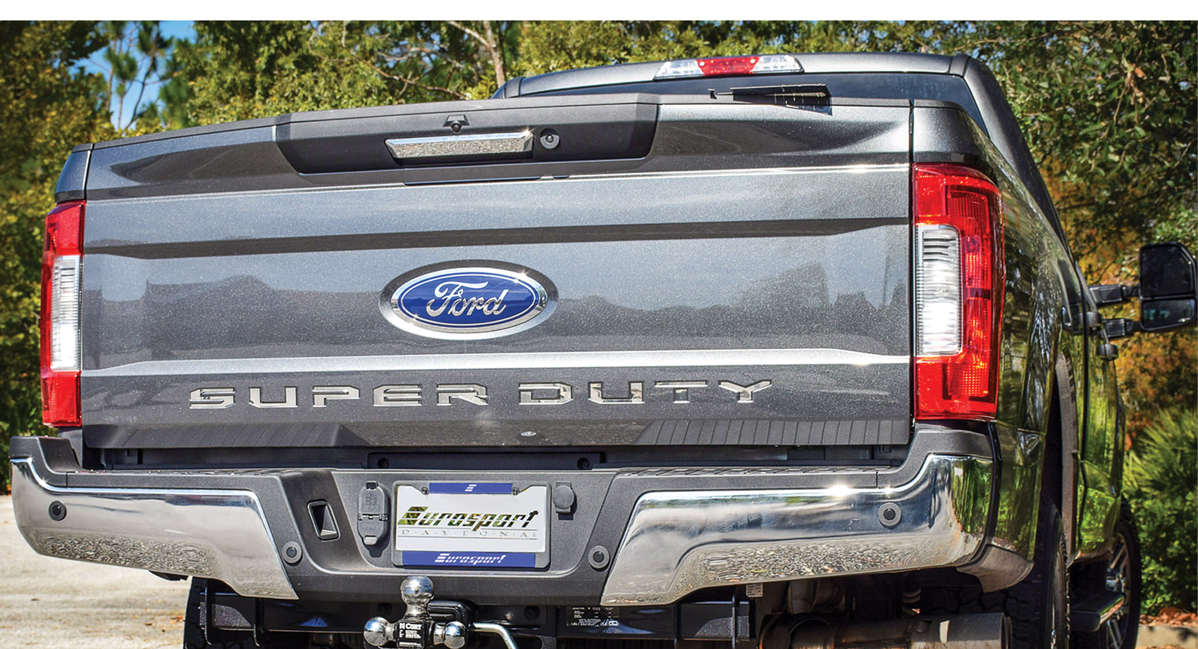 the rear end of a truck with a super duty license plate